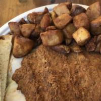 Chicken Fried Steak · Chicken fried steak with gravy, two eggs and choice of toast. With choice of potatoes, cotta...