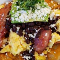 Chilaquiles · Popular.  Corn Tortilla chips, salsa verde, two eggs, choice of chorizo, bacon or sausage, c...