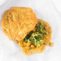Doubles · HAND MADE LAYER OF TURMERIC DOUGH TOPPED WITH CURRY CHICKPEAS,  TAMARIND SAUCE, MANGO CHUTNE...