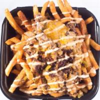 Mega Carne Asada Fries · Prime Steak, green peppers and onions covered with cheddar jack cheese and smoked chipotle s...