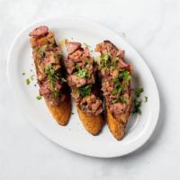 Chopped Liver Toast · Baguette, chopped chicken liver with caramelized onion, and apple, chives