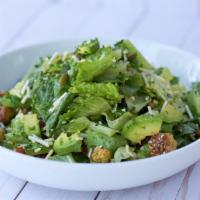 Caesar Salad · Hearts of romaine, baby spinach, croutons, avocado, roasted pepitas, parmesan cheese, and Ca...