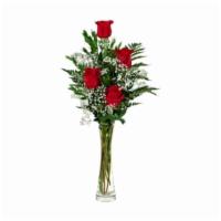 4 Red Roses · Standard. Four red roses, florist arranged in a glass vase with greens and baby's breath.