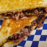 Pastrami Grilled Cheese Sandwich  · On sourdough bread, American cheese, topped with pastrami.