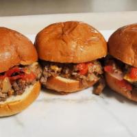Cheesesteak Sliders · 3 freshly grilled cheesesteak sliders with roasted red peppers, onions.