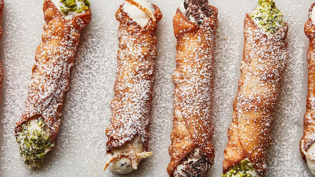 Cannoli · Fried pastry dough stuffed with pastry cream.