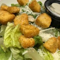 Caesar Salad · Chopped romaine, micro croutons, shaved Parmesan, roasted heirloom tomatoes, and Caesar dres...
