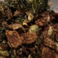 Brussel Sprouts · Deep-fried and tossed with olive oil, applewood-smoked bacon, spiced pecans and grated Parme...