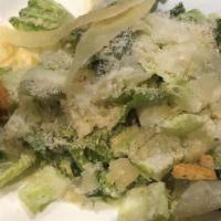 Caesar Salad · Romaine, shaved parmigiano, croutons, and Caesar dressing.