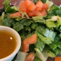 House Green Salad · Romaine, fresh tomato, olives, pepperoncini, choice of dressing.