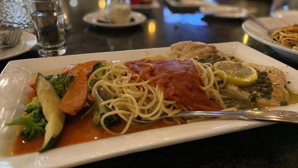 Chicken Piccata · Chicken, capers, lemon, butter white wine sauce, served with a side of spaghetti Pomodoro.