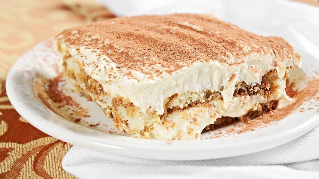 Tiramisu · Sweet ladyfingers soaked in espresso liquer, then layered between fluffy sheets of whipped cream icing. Topped with cocoa.