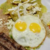 Chilaquiles · Deep fried crispy tortilla dipped in red or green sauce topped with onions, cheese, and sour...