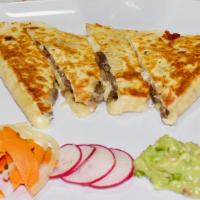 Quesadilla · Giant flour tortilla grilled with cheese, topped with veggies & avocado.