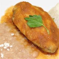 Chile Relleno · Chile relleno is paired with rice, beans and tortillas.