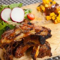 Costillitas · Vegetarian. Baby back ribs with coconut milk, fresh rosemary, Cuban roast peppers, mango rel...