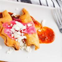 Empanada De Pollo · Marinated chicken leg meat, chipotle and green peppers salsa tomatillo.