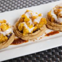 Sopes Del Platano · Vegetarian. Refried black beans, refried plantain and sour cream.