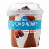 Bunny Tracks Load'D Sundae · Soft vanilla frozen dairy dessert perfectly blended with caramel and fudge swirls, with choc...