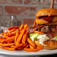 Bbq Burger · Applewood bacon, onion rings, Pepper Jack cheese, lettuce, tomatoes, and BBQ sauce.