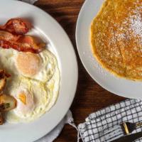 Triple Plate · Two eggs, country potatoes,  two buttermilk pancakes, and your choice of bacon or chicken ap...