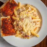 Chicken Carbonara · Penne in creamy carbonara sauce, with onions, applewood smoked bacon, chicken, garlic and ro...