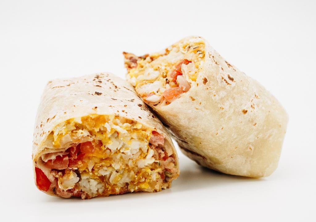 Breakfast Burrito · Eggs, tater tots, chipotle aioli, cheddar cheese, and house salsa.