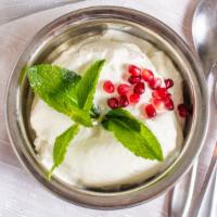 Persian Yogurt · Vegetarian. Whipped creamy plain yogurt mixed with cucumber, salt, garnished with mint serve...