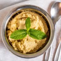 Hummus · Vegetarian. Dip made from chickpeas served with pita bread.