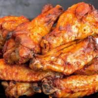 20 Pieces - Chicken Wings · Bone-in, Buffalo-style wings seasoned with a sauce, and BAKED. Add dipping sauce for even mo...