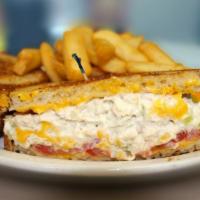 Tuna Melt Sandwich · White albacore tuna or our own chunky chicken salad, grilled on rye with American cheese and...