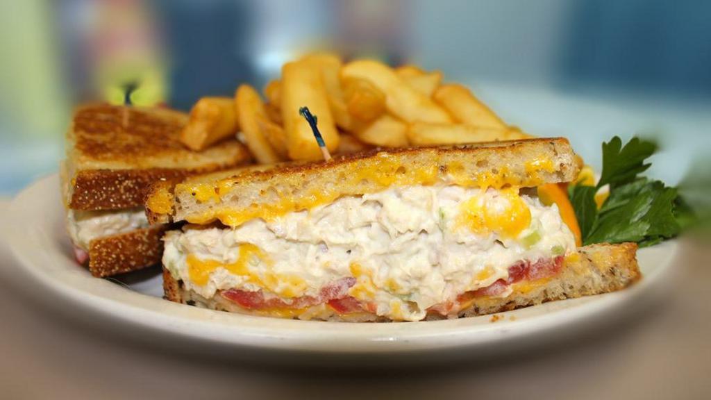 Tuna Melt Sandwich · White albacore tuna or our own chunky chicken salad, grilled on rye with American cheese and sliced tomato.