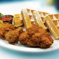 Fried Chicken And Waffles · Choice of three pieces of honey battered crispy fried chicken or four chicken strips accompa...