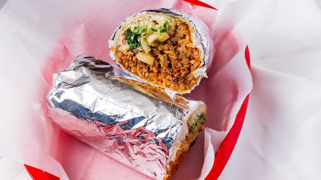 Super Burrito · Includes larger portion of protein choice, rice, beans, cilantro, salsa, guacamole, sour cream, and cheese.