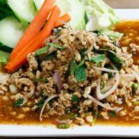Larb · Ground chicken with red shallot, cilantro, mint, chili powder, ground roasted rice and lime ...