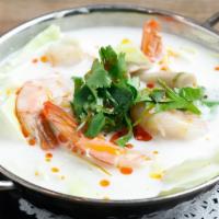 Galangal Coconut Broth · Thai coconut soup with galangal, lemongrass, lime leaves and mushroom