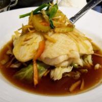 Ginger Fish · Moist and flavorful steamed fillet fish topped with fresh ginger, celery, bell pepper and gi...