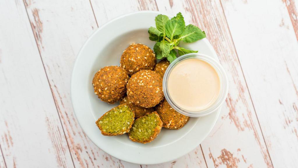 Falafel · Fresh ground chickpeas and our house blend of seasonings, deep fried to perfection.