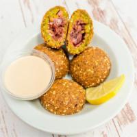 Stuffed Falafel · Our homemade falafel stuffed with marinated onions.