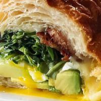 Croissant Bacon Sandwich · overhard eggs, pepper jack cheese, bacon, avocado, tomatoes, spinach, green salad
