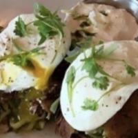 Zucchini & Eggs · Zucchini hash browns topped with two poached eggs, cilantro and side of horseradish.
