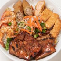 Bun Tom Ga Tau Hu Ky Cha Gio · Vermicelli noodles with grilled shrimp, grilled BBQ chicken, egg roll, shrimp cake in tofu w...