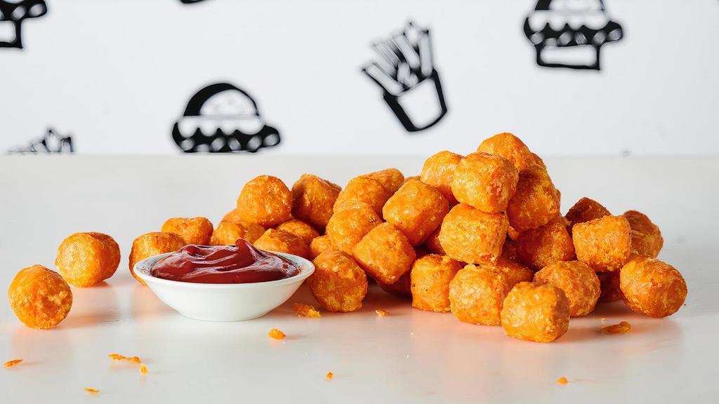 Sweet Potato Tots · Crispy fried sweet potato tots, perfect for dipping