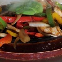 Fajitas · Sizzling hot and traditionally cooked onions, tomatoes, and bell peppers served with cilantr...