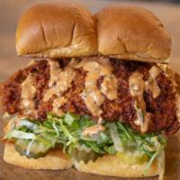 Hot Chick · Spicy fried chicken breast, secret sauce, pickles & lettuce; on grilled king's hawaiian rolls