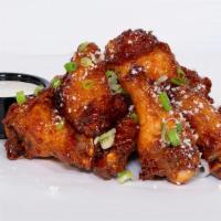 Chipotle Honey Wings · Chipotle honey glaze, cotija cheese, scallions. Served with miso ranch or blue cheese.