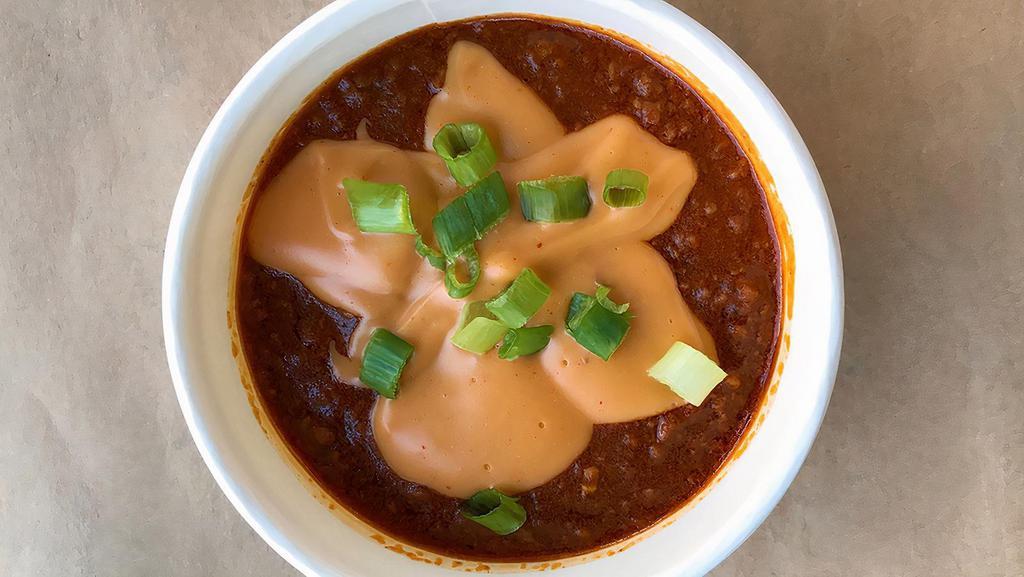 Haus Chili · All beef chili, cheese sauce, diced sweet white onion.