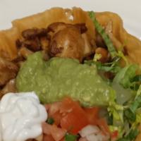 Taco Salad · Chicken or beef, beans, lettuce, sour cream, guacamole, salsa fresca and cheese