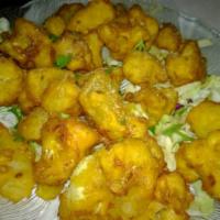 Pakoras · Pieces of vegetables, meat, chicken or fish coated in a seasoned batter, and deep-fried.