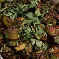 Bhindi Masala · Mildly spiced okra pan fried with onions, tomatoes, and spices.